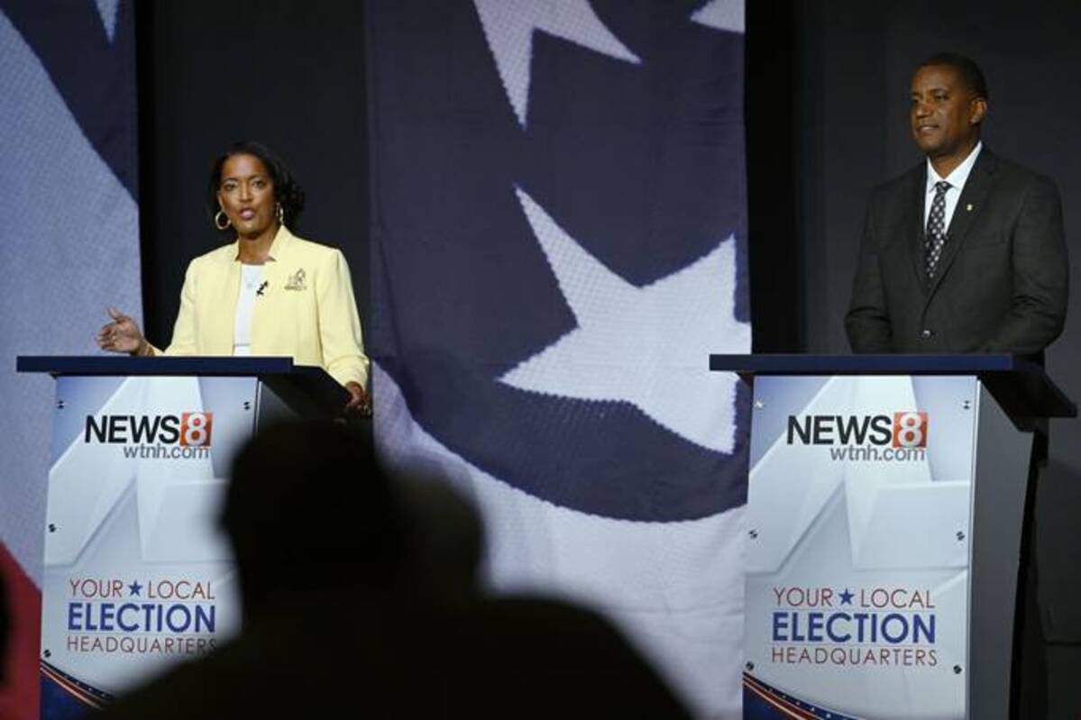 U.S. Rep. Jahana Hayes (D-Conn.), left, speaks during a debate against Republican House candidate George Logan on Oct. 18 in Waterbury, Conn. (AP Photo/Jessica Hill)