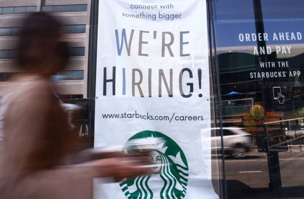 A 'We're Hiring!' sign is posted at a Starbucks. (Mario Tama/Getty Images)