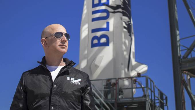 Blue Origin founder Jeff Bezos inspects New Shepard's West Texas launch facility before the rocket's maiden voyage, in West Texas. (Handout photo from Blue Origin)