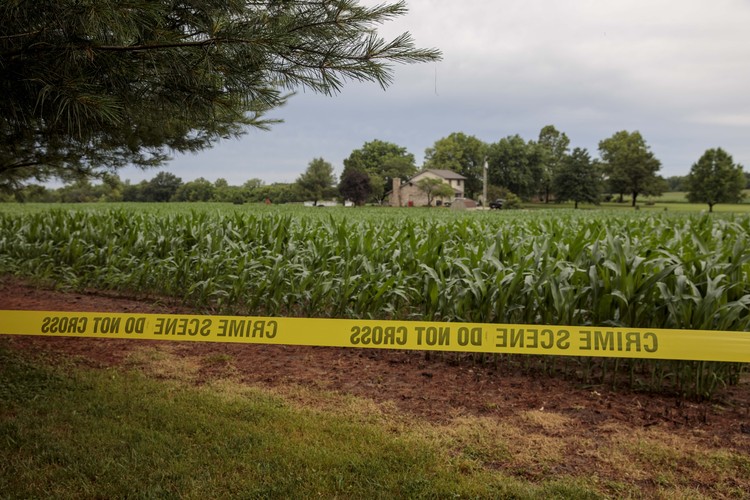 Crime scene tape and a neighbor's house is seen near the home of James Hodgkinson, in Belleville, Ill.&nbsp;(Whitney Curtis/The Washington Post)</p>  