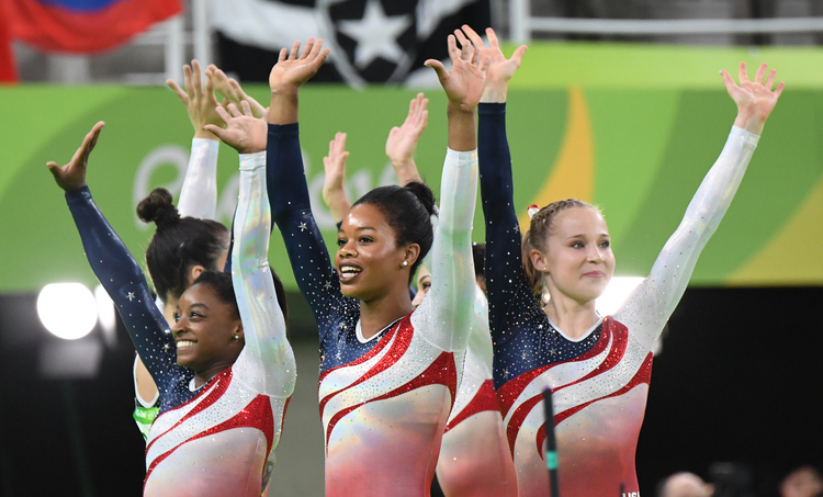USA Women gymnasts celebrate after winning Gold in Rio.&nbsp;(Jonathan Newton/The Washington Post)</p>  