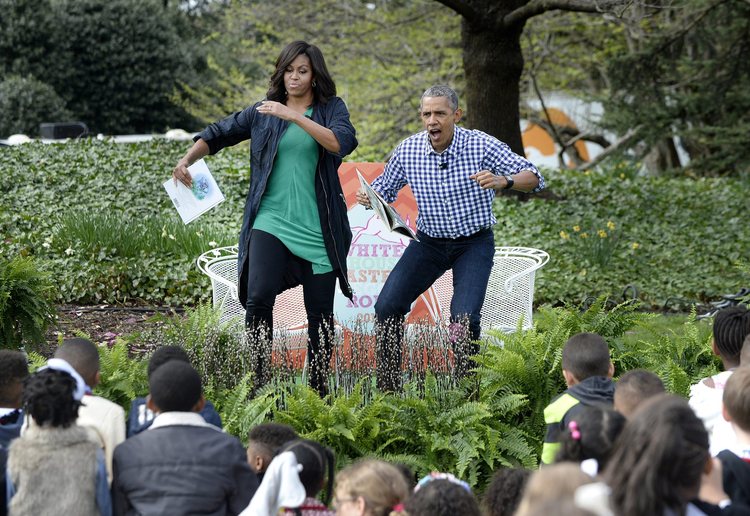 Barack and&nbsp;Michelle Obama imitate monsters as they read a story during last year's Egg Roll.&nbsp;(EPA/Oliver Douliery)&nbsp;</p>  