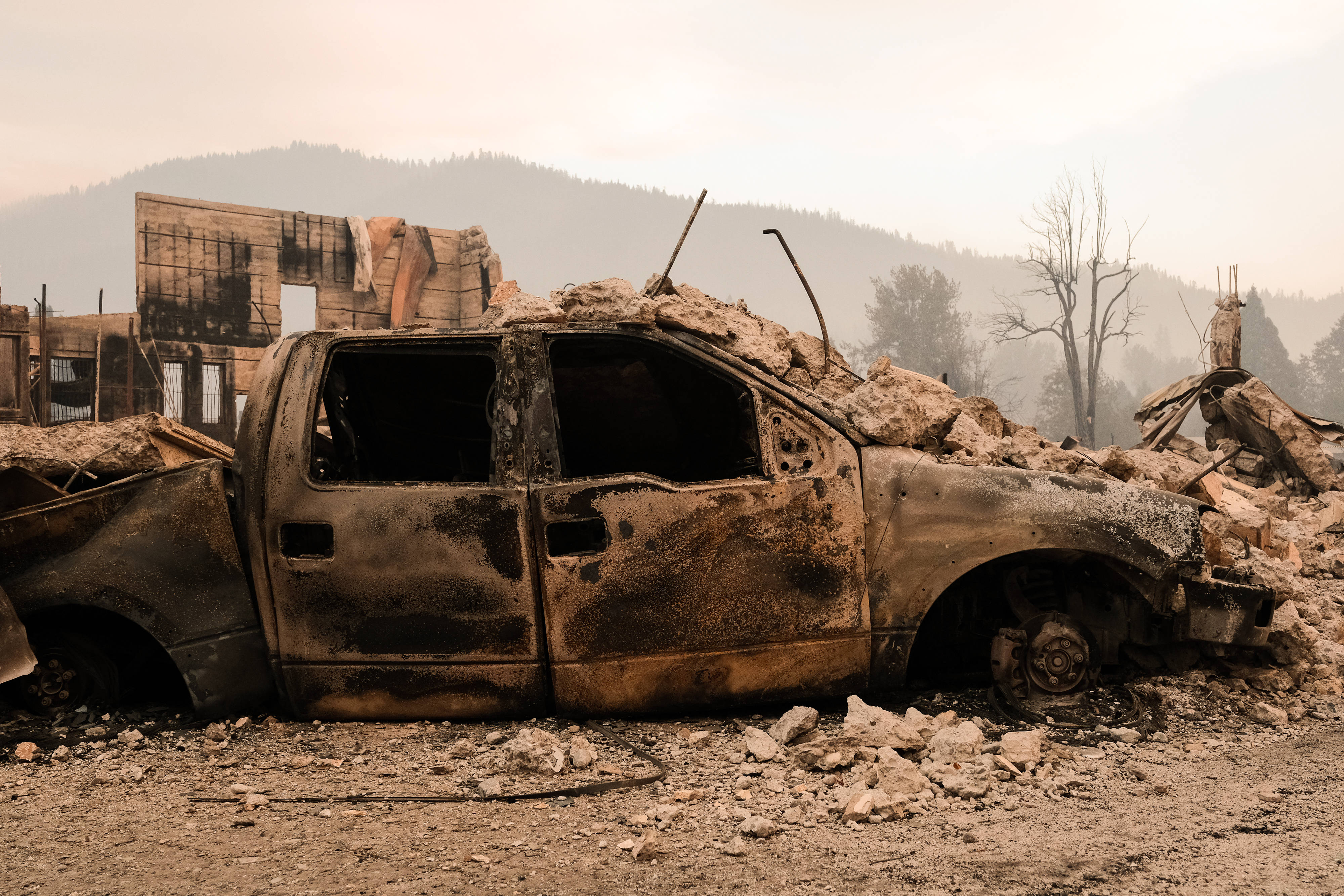 A burned vehicle destroyed by the Dixie Fire in California, the second-largest fire in state history. Scientists say climate change is exacerbating these events. (David Odisho/Getty Images)