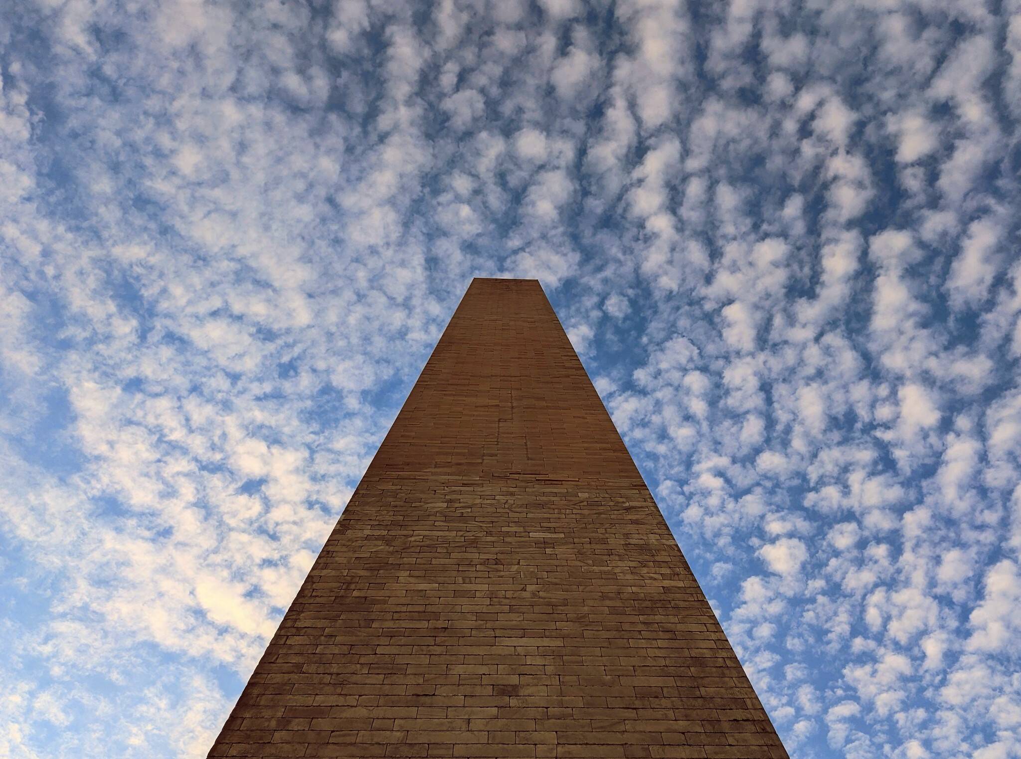 Fluffy clouds above the Washington Monument on Saturday. (angela n./Flickr/angela n.)