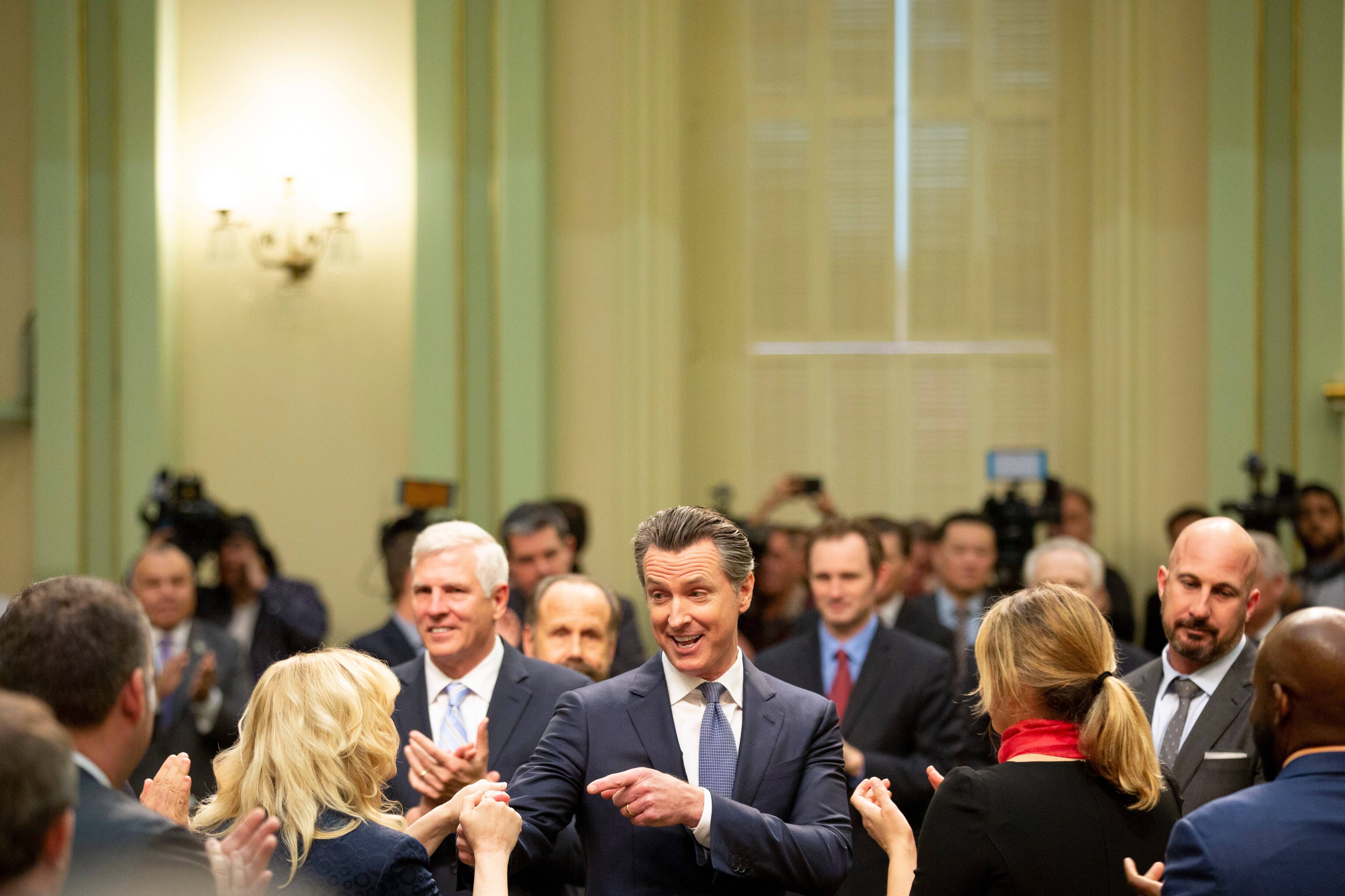 California Gov. Gavin Newsom greets assembly members before he delivers the State of the State address at the California Capitol in Sacramento on Feb. 12, 2019. (Santiago Mejia/San Francisco Chronicle/AP)