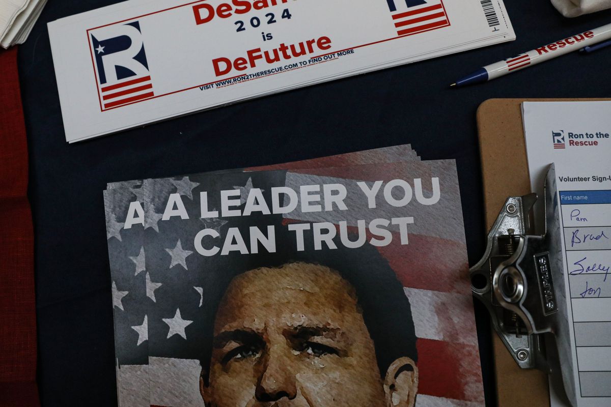 &nbsp;A vendor's table promoting Florida Gov. Ron DeSantis (R) at the New Hampshire Republican State Committee fundraiser on Jan. 28. (Cheryl Senter for the Washington Post)