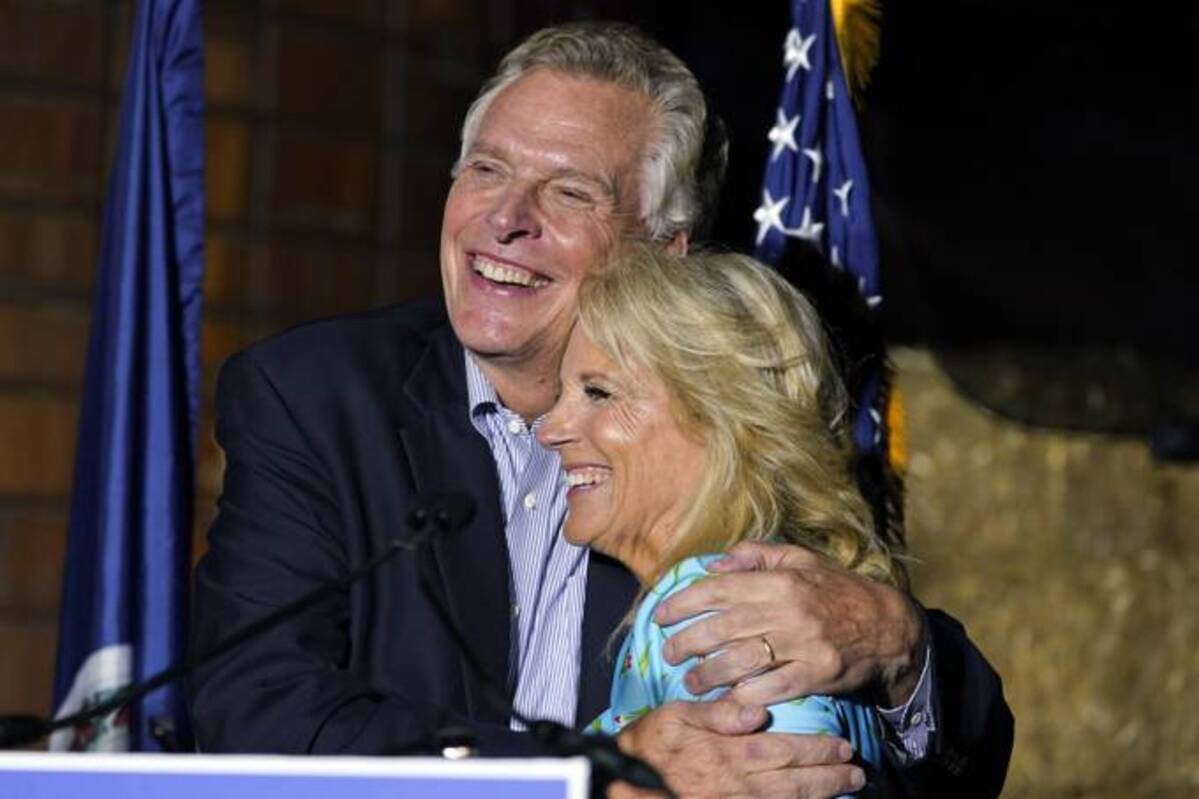 First lady Jill Biden gets a hug from Democratic gubernatorial candidate Terry McAuliffe during a rally in Richmond. (Steve Helber, AP File)