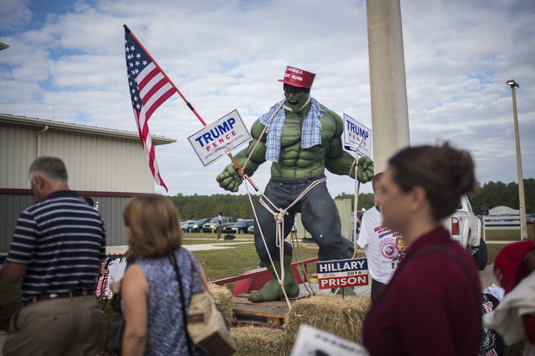 A hulk statue is seen outside as supporters make their way into a&nbsp;Trump rally in Jacksonville. (Jabin Botsford/The Washington Post)</p>  