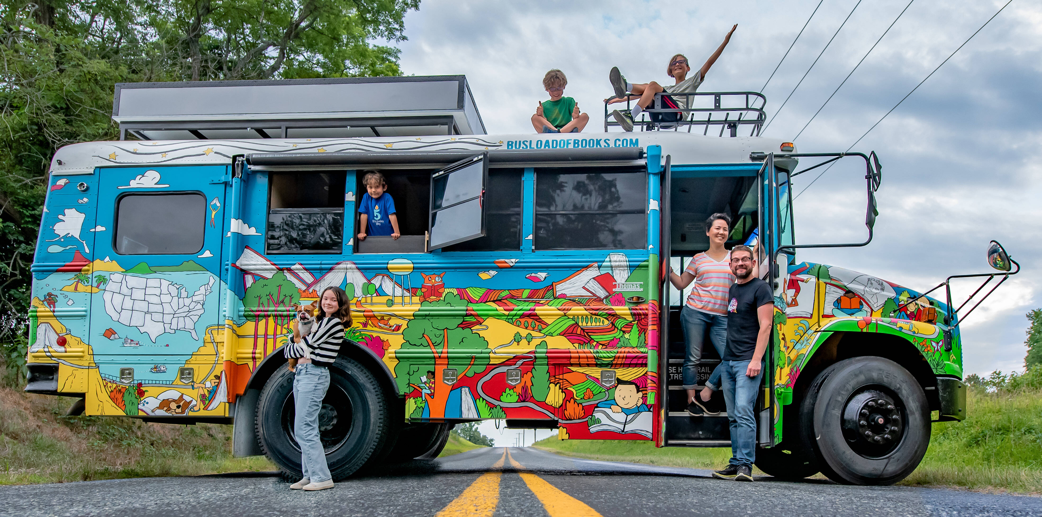 Robbi Behr, Matthew Swanson, their four children and their dog, Dumbles, on the Busload of Books tour. (Photo by Carolyn Fuss Thompson)