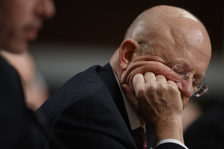 Director of National Intelligence James Clapper listens to questions last week while testifying before the Senate Armed Services Committee. (Evan Vucci/AP)</p>  