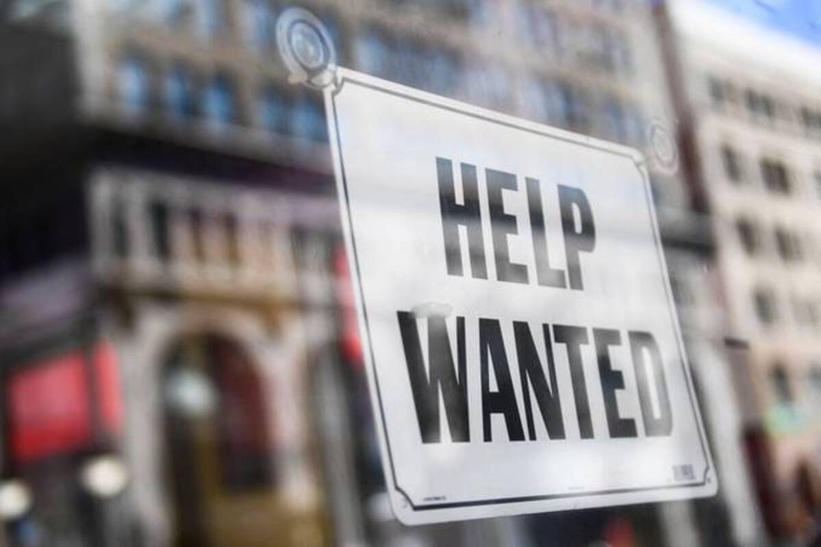 A help wanted sign is displayed in the window of a fast-food restaurant in downtown Los Angeles. (Patrick T. Fallon/AFP via Getty Images)