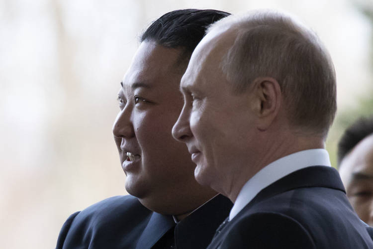 Vladimir Putin and Kim Jong Un pose for photos in Vladivostok, Russia. (Alexander Zemlianichenko/AP)  