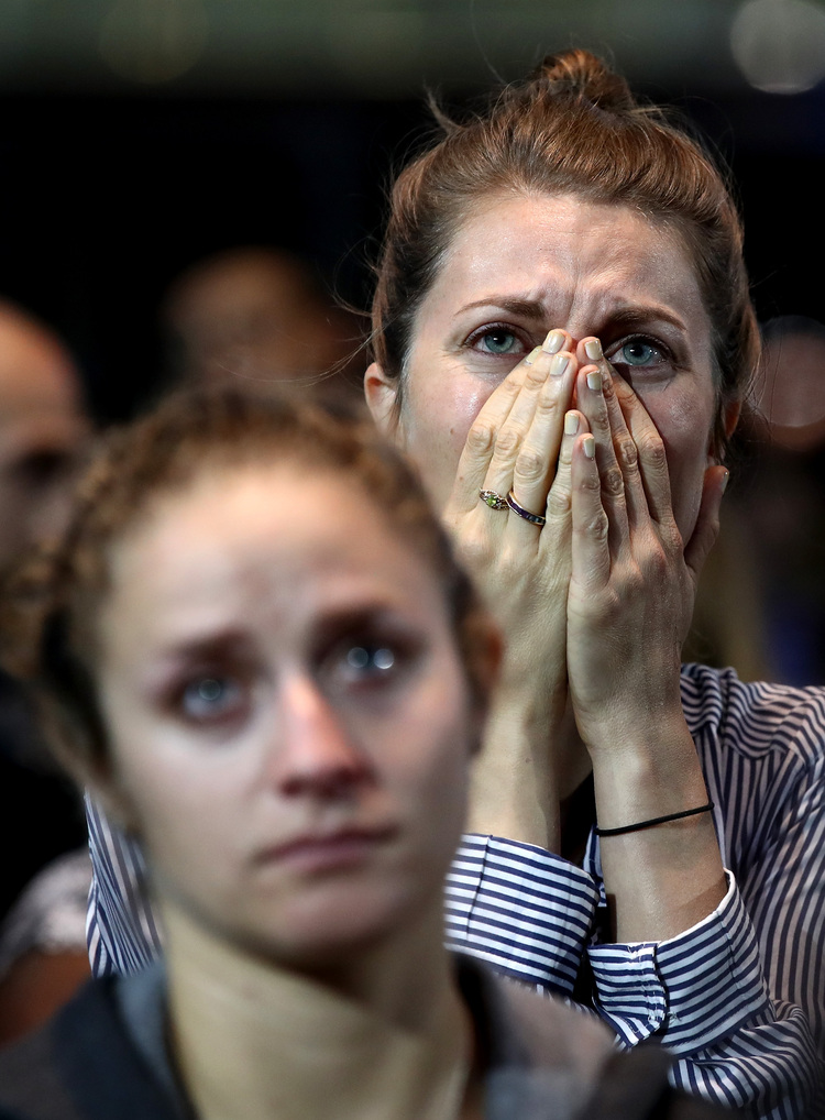 A woman reacts to election returns at the Jacob K. Javits Convention Center on Tuesday night.&nbsp;(Win McNamee/Getty Images)</p>  