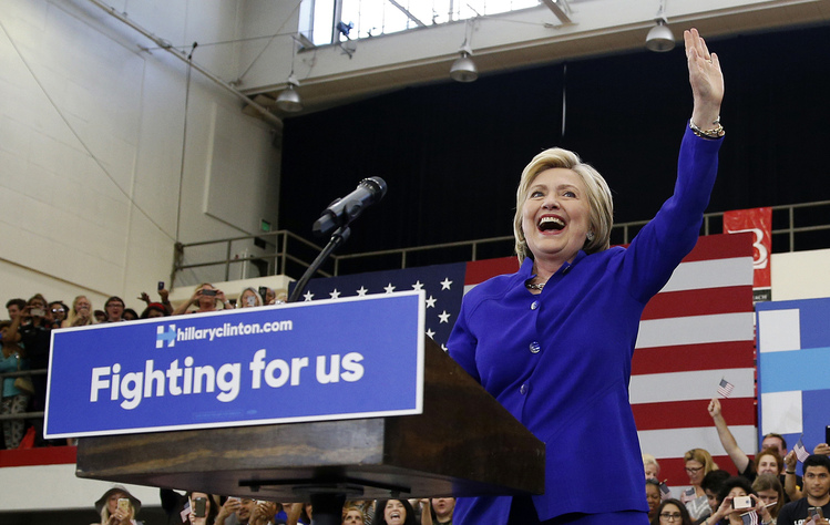 Clinton takes&nbsp;the&nbsp;stage at a rally in&nbsp;Long Beach, Calif.&nbsp;(AP/John Locher)</p>  