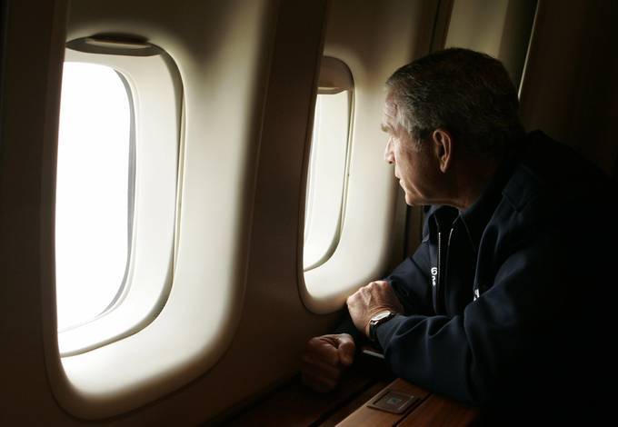 President Bush looks out the window of Air Force One inspecting damage from Hurricane Katrina in 2005. (AP Photo/Susan Walsh)