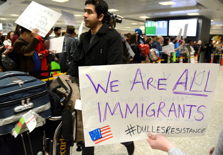 Demonstrators cheer at Dulles International Airport to protest Trump's travel ban. (Mike Theiler/Reuters)</p>