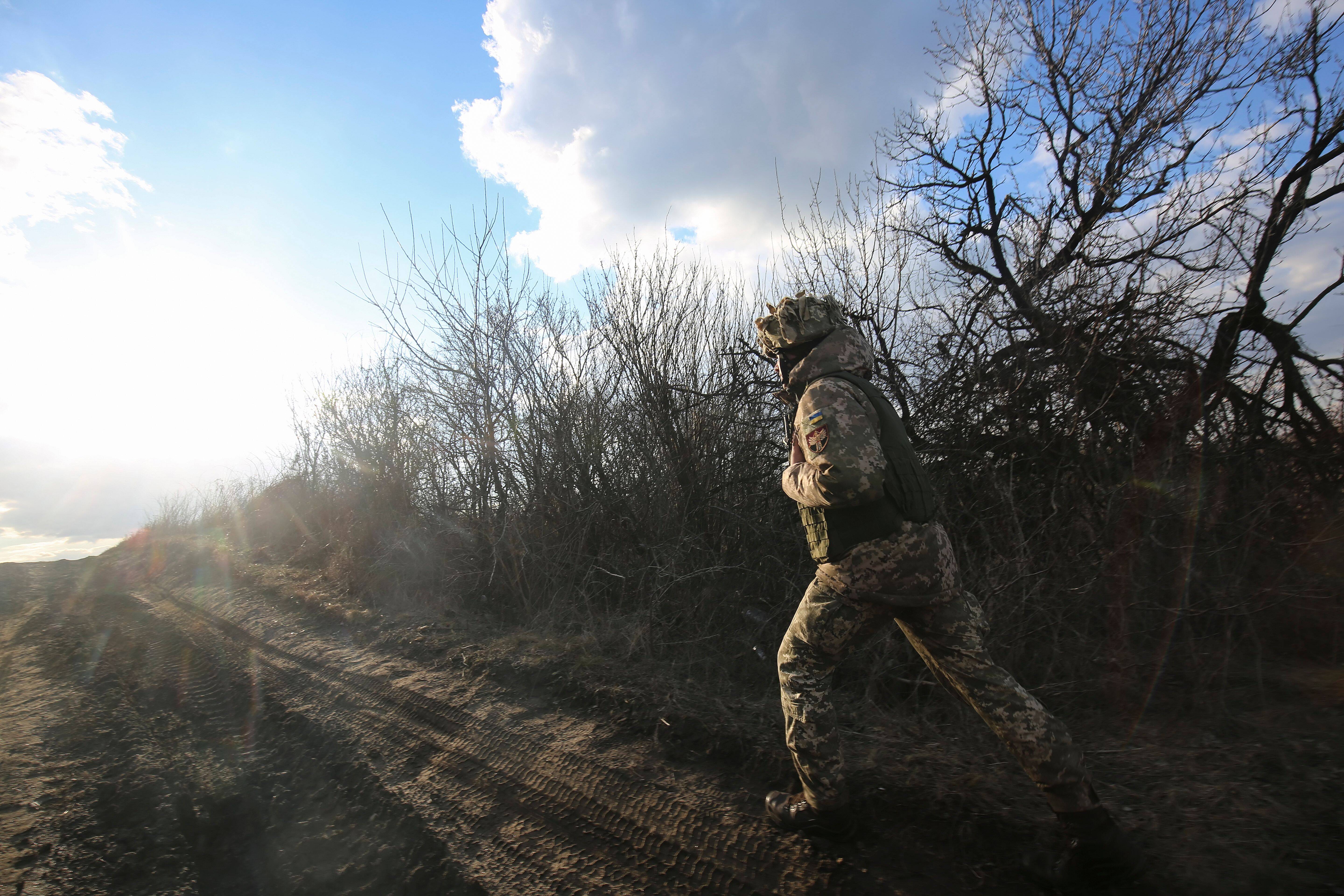 A Ukrainian service member on the front lines in eastern Ukraine on Monday. (Alisa Yakubovych/EPA-EFE/Shutterstock)