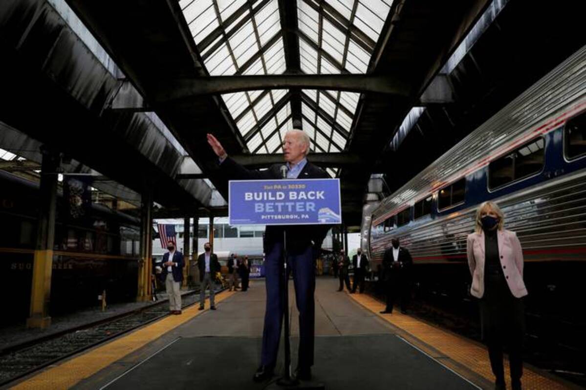 Then-Democratic Joe Biden speaks next to his campaign train while making a campaign stop in Pittsburgh in September 2020. REUTERS/Mike Segar/File Photo