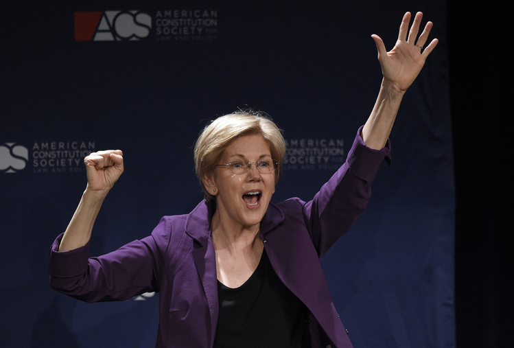 Elizabeth Warren&nbsp;waves to the crowd after finishing her speech Thursday night at the American Constitution Society convention in Washington.&nbsp;(AP Photo/Nick Wass)</p>  