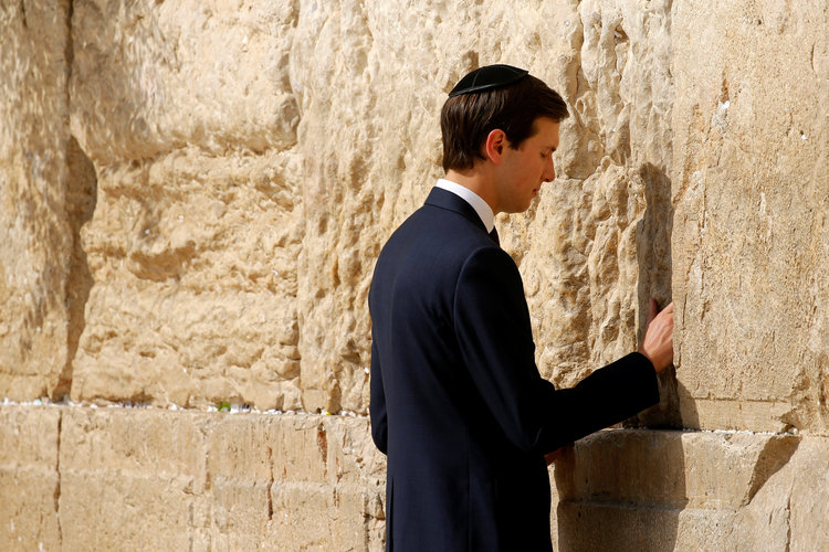 Jared Kushner leaves a note at the Western Wall in Jerusalem in May. (Jonathan Ernst/Reuters)</p>  