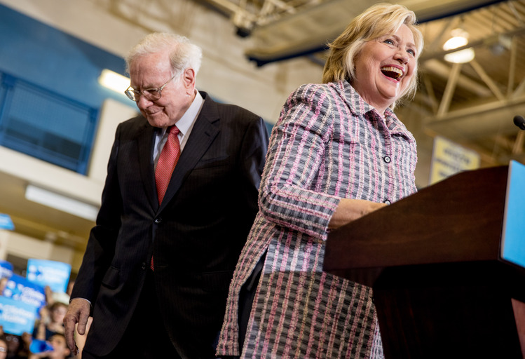 Clinton stands alongside Warren Buffett introduces her at a rally in Omaha. (AP/Andrew Harnik)</p>
