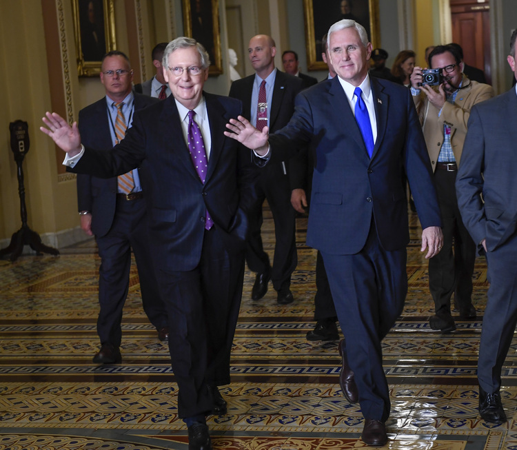 Mitch McConnell walks through the Capitol with Mike Pence. (Bill O'Leary/The Washington Post)</p>  