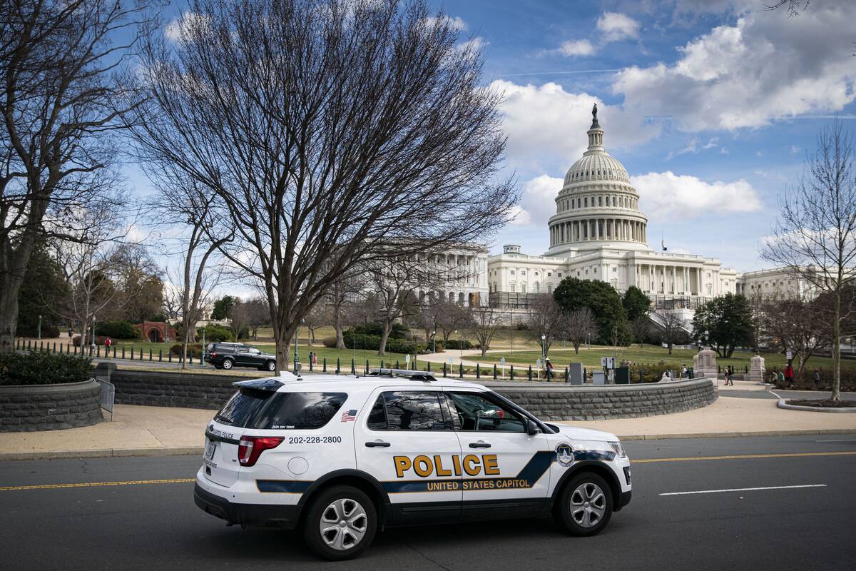 A U.S. Capitol Police vehicle patrols the U.S. Capitol on Wednesday, Feb. 23. (Al Drago/Bloomberg)