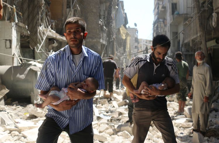 Syrian men carrying babies make their way through the rubble of destroyed buildings following a air strike on the rebel-held Salihin&nbsp;neighborhood&nbsp;of Aleppo. (Ameer Alhalbi/AFP/Getty Images)</p>  