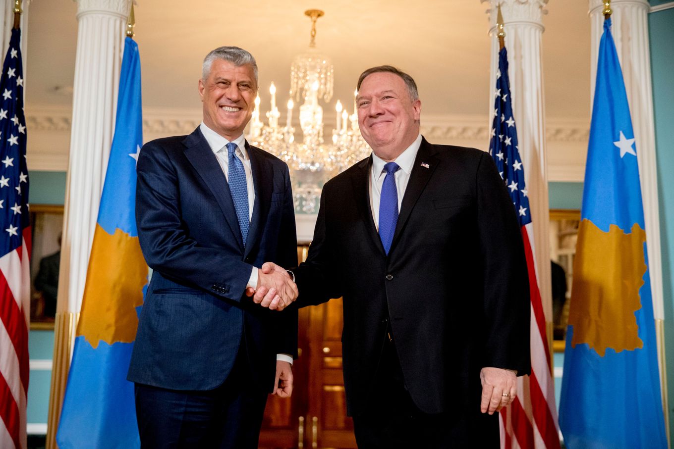 Secretary of State Mike Pompeo, right, and Kosovo President Hashim Thaci shake hands in Washington in February 2020. (Andrew Harnik/AP)