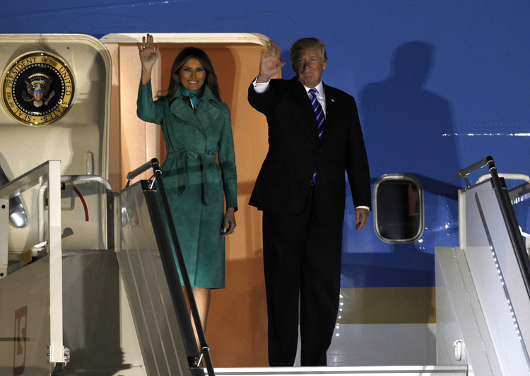 Donald and Melania Trump wave from the Air Force One upon their arrival to Warsaw, Poland. (/Czarek Sokolowski/AP)</p>  