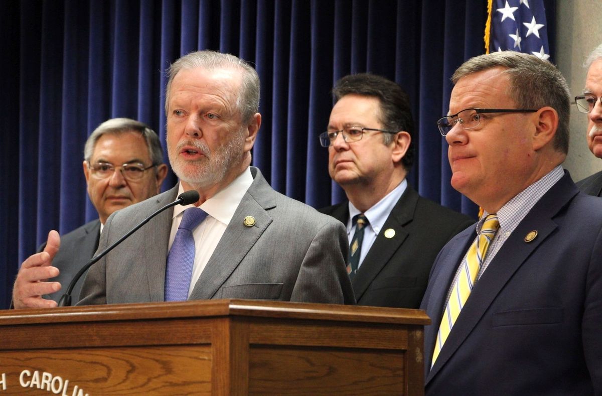 North Carolina Senate leader Phil Berger (R), left, speaks alongside House Speaker Tim Moore (R). (Hannah Schoenbaum/AP)