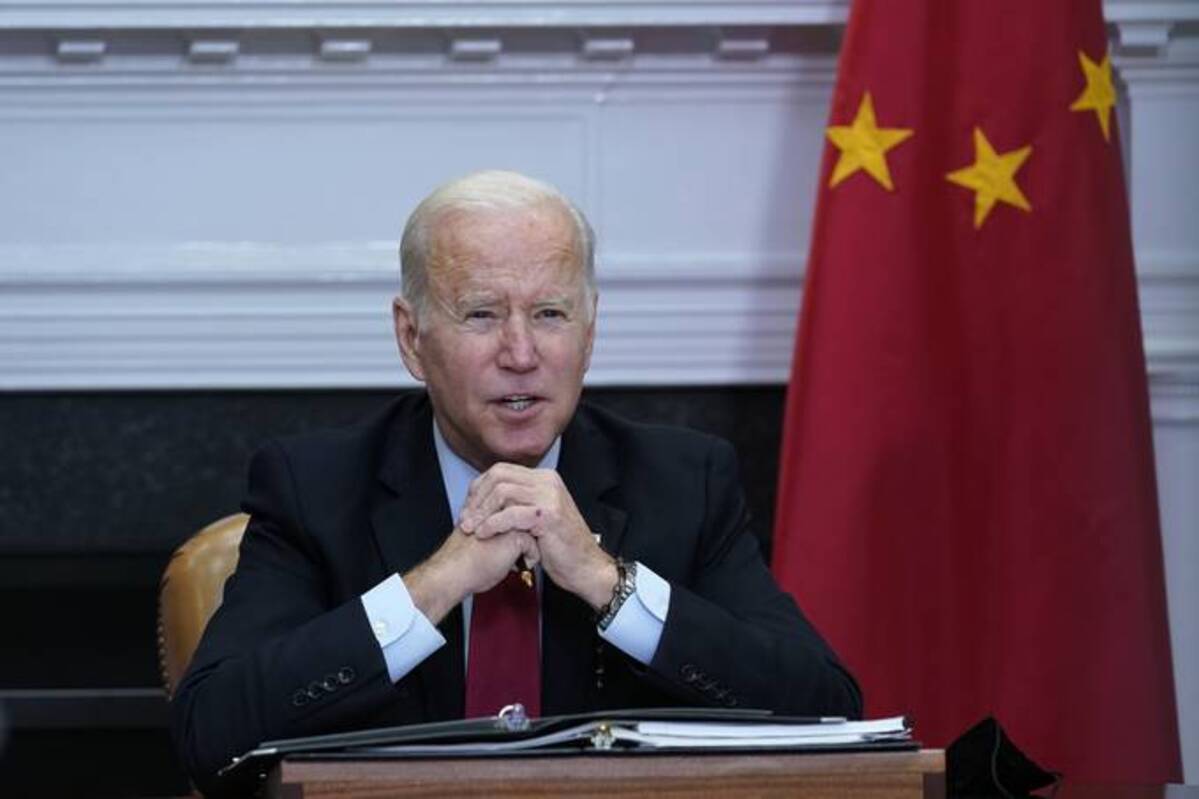 President Biden speaks as he meets virtually with Chinese President Xi Jinping from the Roosevelt Room of the White House. (Susan Walsh/AP)