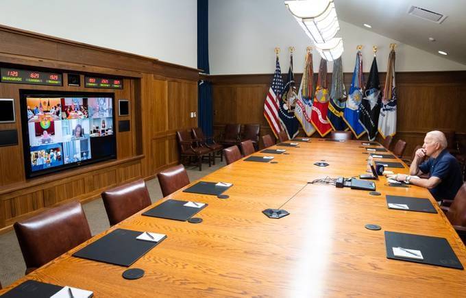 In this White House handout, President Joe Biden and Vice President Kamala Harris (on screen) hold a video conference with the national security team to discuss the ongoing efforts to draw down our civilian footprint in Afghanistan. (Photo by the White House via Getty Images)