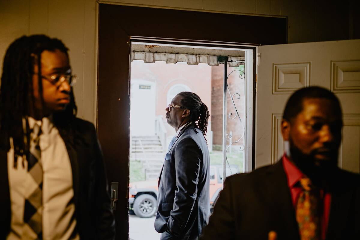 Attorneys Emanuel Powell, left, and Jerryl Christmas accompany Don Clark Jr. to the home of his late father in St. Louis. Clark's father was killed by police officers executing a no-knock raid at multiple addresses in 2017. (Joe Martinez/The Washington Post)