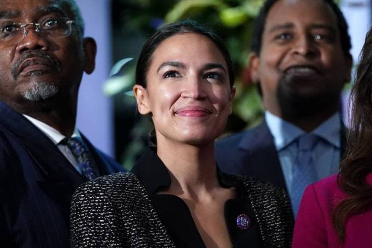 Rep. Alexandria Ocasio-Cortez (D-N.Y.) poses for a picture inside the Blue Zone, SEC at COP26 on Nov. 9 in Glasgow, Scotland. (Ian Forsyth/Getty Images)