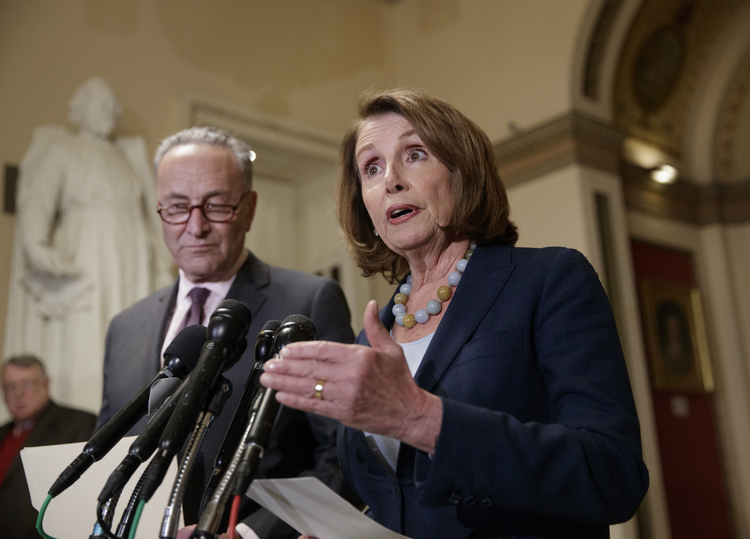 House Democratic Leader Nancy Pelosi and Senate Democratic Leader Chuck Schumer speak to reporters in March. (J. Scott Applewhite/AP)</p>  