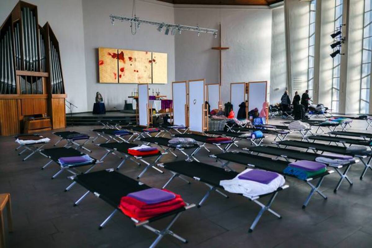 Camp beds are set up for refugees who fled their native, war-torn Ukraine, in the Emmaus Kirche Protestant church that has become their temporary shelter in Berlin, Germany. (Photo by Carsten Koall/Getty Images)