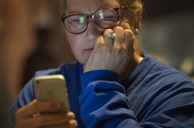 Vicki Slater, a Democratic activist, watches returns come in on websites at a watch party Tuesday night in Jackson, Miss.&nbsp;(Linda Davidson/The Washington Post)</p>  
