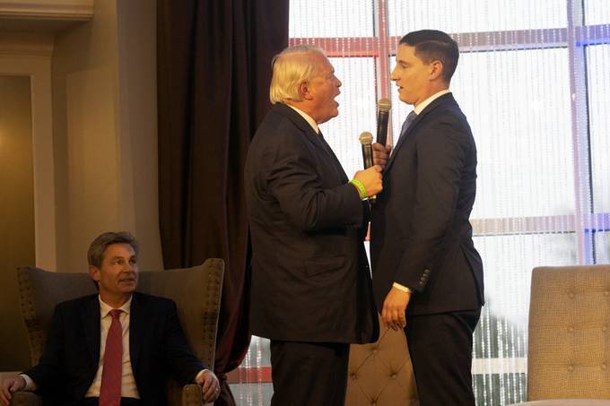 Mike Gibbons, left, and Josh Mandel exchange heated arguments at the FreedomWorks Forum for Ohio's Republican Senate Candidates on March 18, in Columbus, Ohio. State Sen. Matt Dolan is pictured behind them. (Andrew Spear/Getty Images)