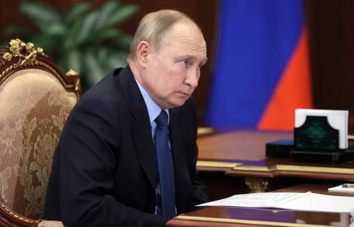 Russian President Vladimir Putin listens to Minister of Justice Konstantin Chuychenko during their meeting in the Kremlin in Moscow on Monday. (Mikhail Metzel/Sputnik/Kremlin Pool Photo via AP)