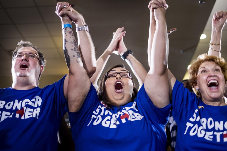 Hillary Clinton volunteers attend a recent event emphasizing the importance of early voting. (Photo by Melina Mara/The Washington Post)</p>