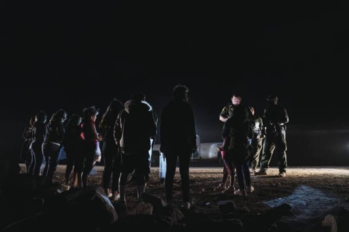 U.S. Border Patrol agents process migrants who crossed the U.S.-Mexico border on June 24 in Yuma, Ariz. (Eric Thayer/The Washington Post)