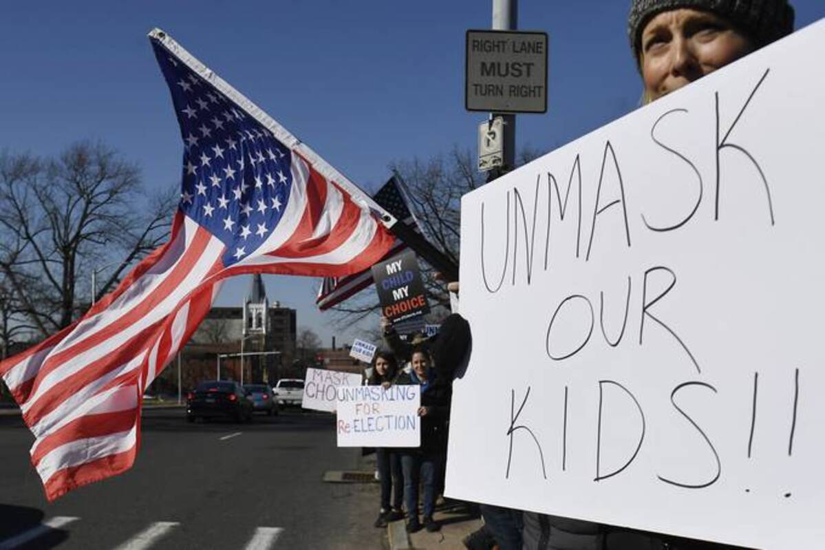 Democratic governors moved to lift mask mandates in droves this week, including plans to drop the requirement in schools in the coming weeks. (AP Photo/Jessica Hill)
