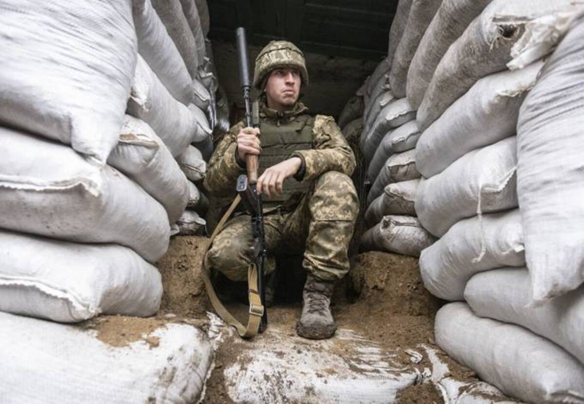A Ukrainian soldier in the trench on the line of separation from pro-Russian rebels in Ukraine on Friday. (AP Photo/Andriy Dubchak)
