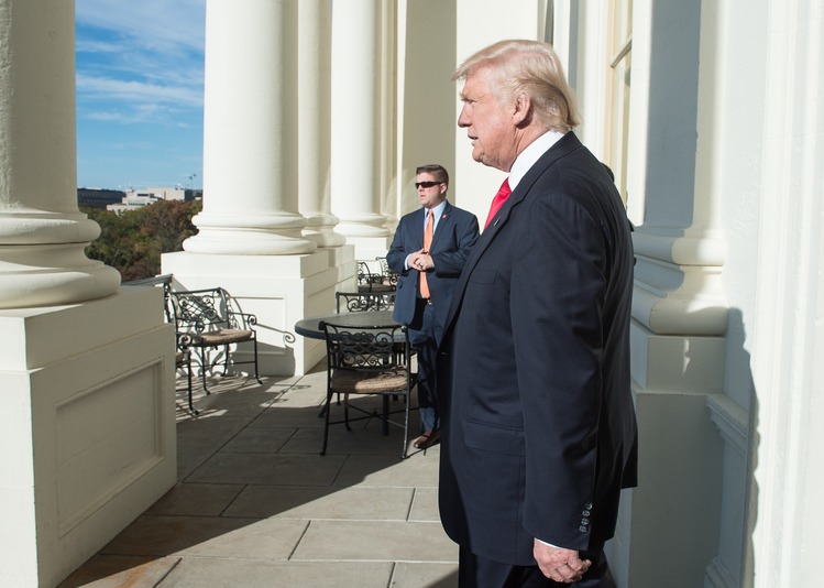Trump checks out Paul Ryan's balcony at the Capitol last week. (Nicholas Kamm/AFP/Getty)</p>  