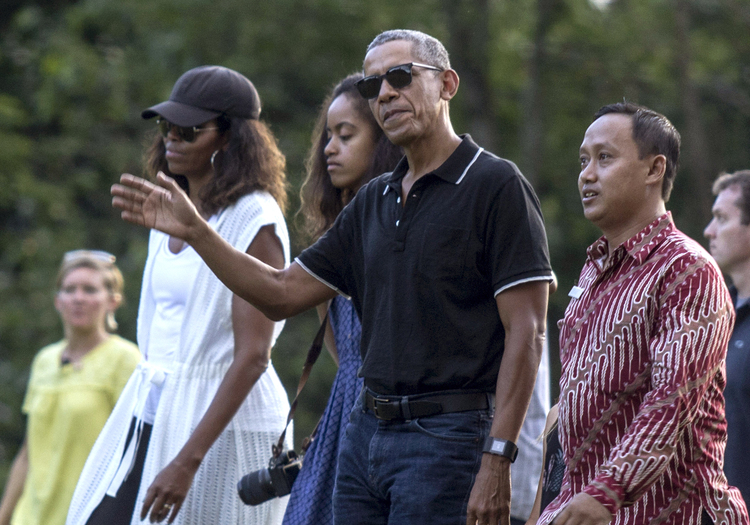 Barack Obama tours the Borobudur Temple in Central Java, Indonesia, with Michelle and Malia on June 28. (Slamet Riyadi/AP)  