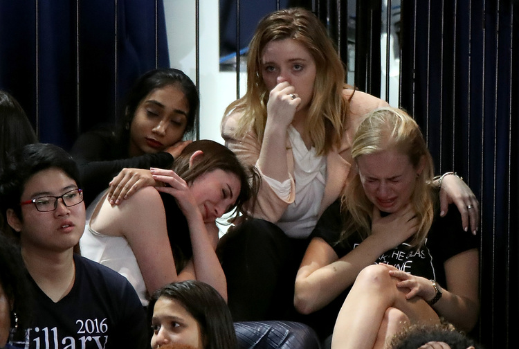 A group of women react as voting results come in at Clinton's election night event at the Javits Convention Center in New York. (Drew Angerer/Getty Images)</p>  