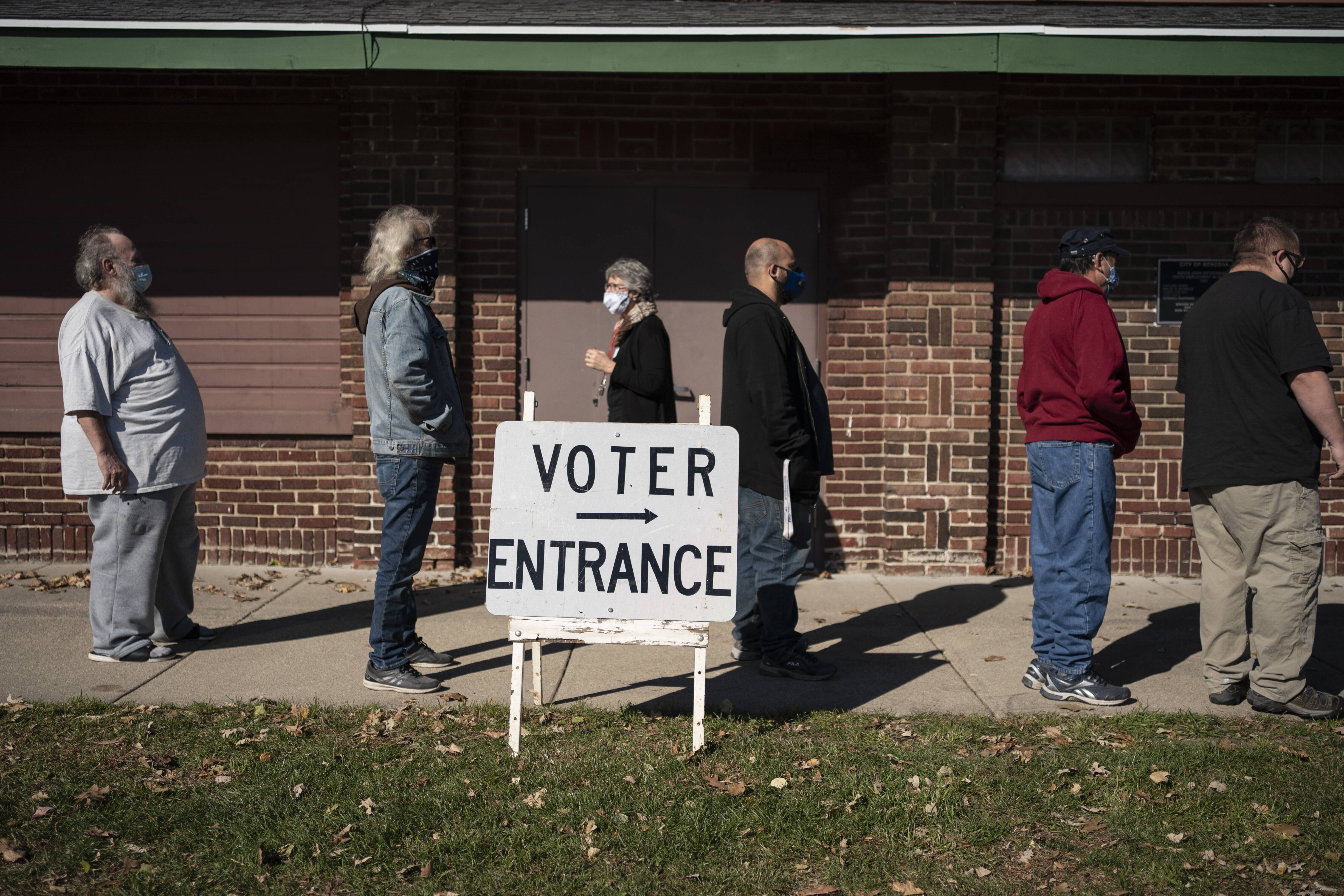 Voters in Wisconsin on Election Day. Biden won the state by less than a percentage point. (Wong Maye-E/AP)