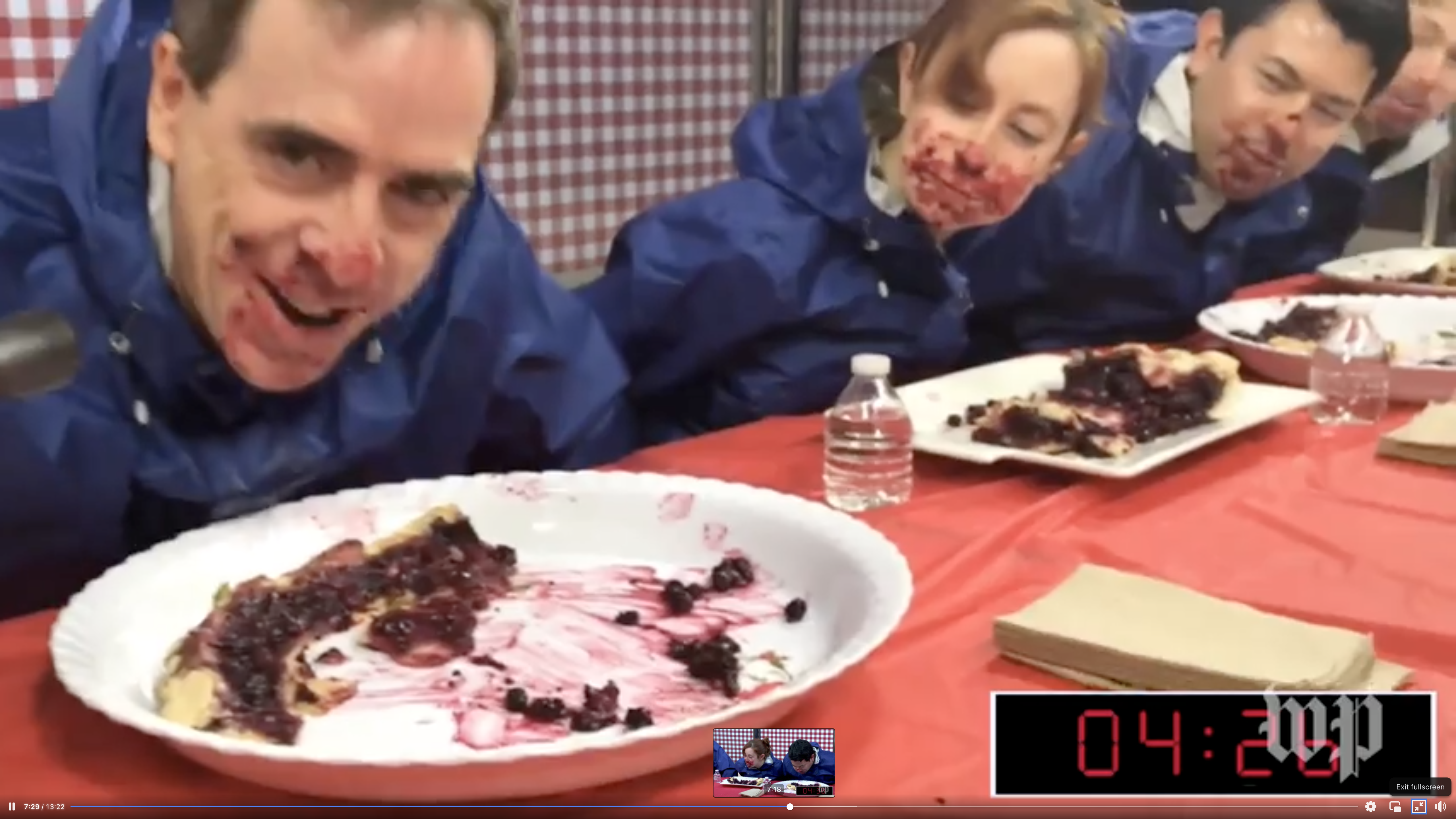 Ron Charles, Sarah Parnass, Brian Cleveland and Drew Goins at a pie-eating contest to commemorate Pi Day at The Washington Post, March 14, 2017. (Screenshot)