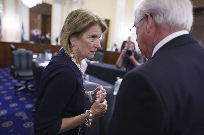 Sen. Shelley Moore Capito (R-W.Va.), the GOP's lead negotiator on a counter-offer to President Joe Biden's infrastructure plan, confers with Sen. Roger Wicker (R-Miss.). (J. Scott Applewhite/AP)